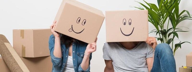 happy couple preparing for a house relocation
