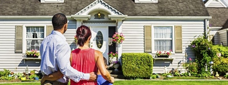 a family inspecting a house before buying