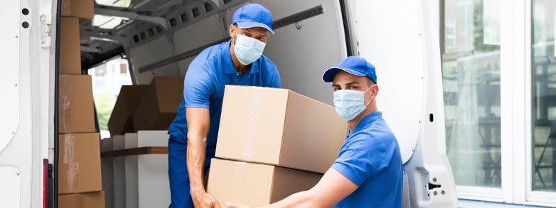 young professionals loading a van