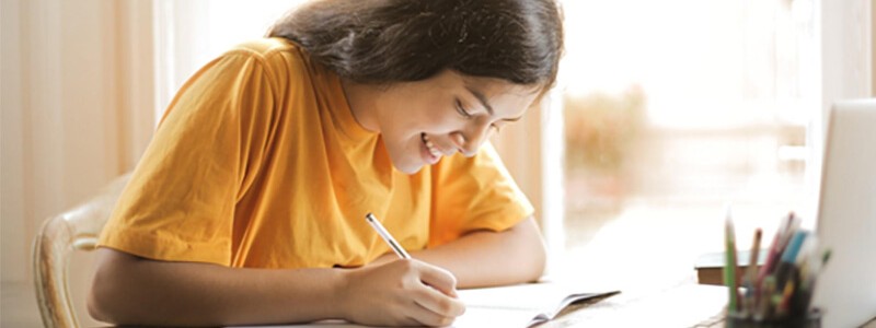 Young woman noting down something