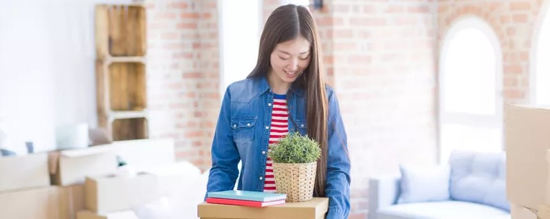 young woman inside of her new house