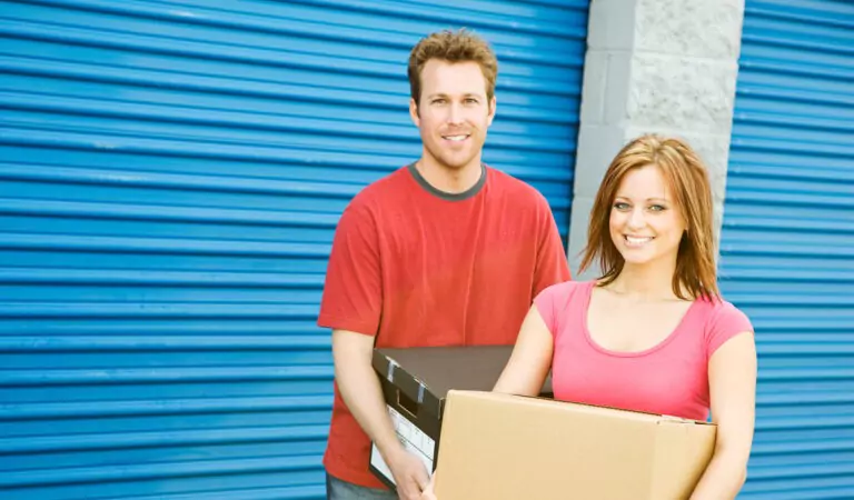 couple standing outside of a storage unit