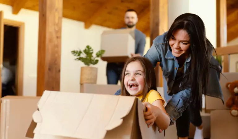 family looking happy inside of their new house
