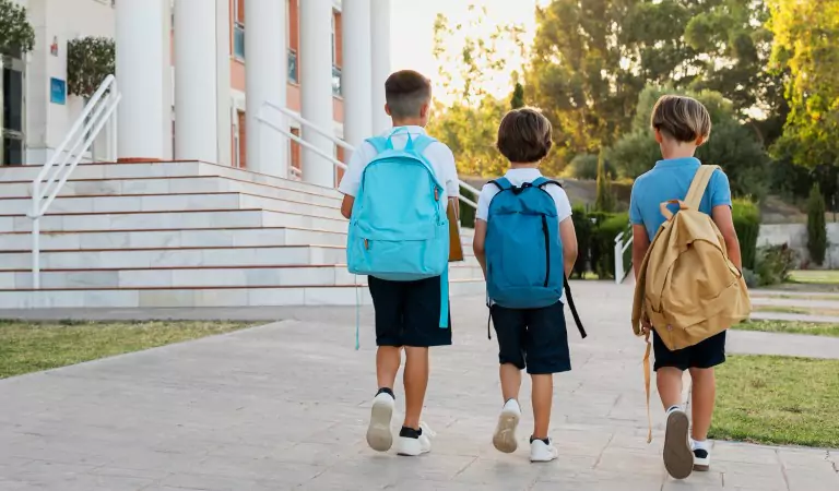young kids outside of their school