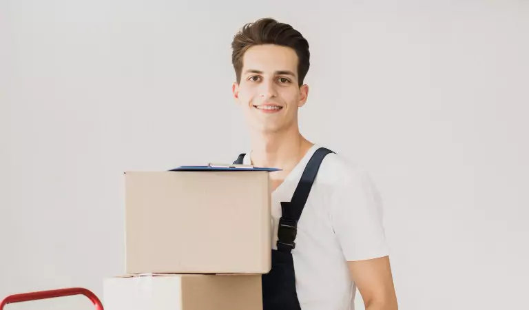 young professional holding a cardboard box in hands