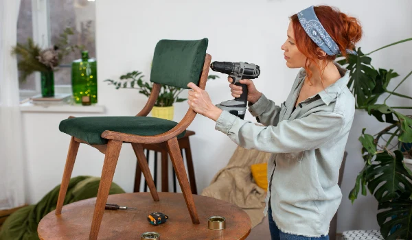 A woman repairing a chair
